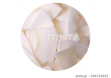 White dry coconut flakes in a wooden bowl prepared for making desserts White dry coconut flakes in a wooden bowl prepared for making desserts 106328043