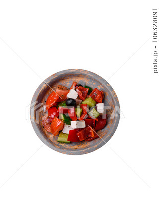 Delicious fresh juicy greek salad with feta cheese, olives, peppers and tomatoes Delicious fresh juicy greek salad with feta cheese, olives, peppers and tomatoes 106328091
