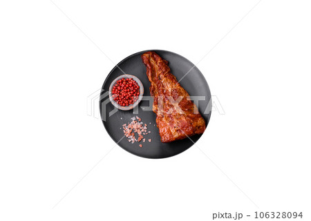 Delicious grilled or smoked pork ribs with salt, spices and herbs Delicious grilled or smoked pork ribs with salt, spices and herbs 106328094