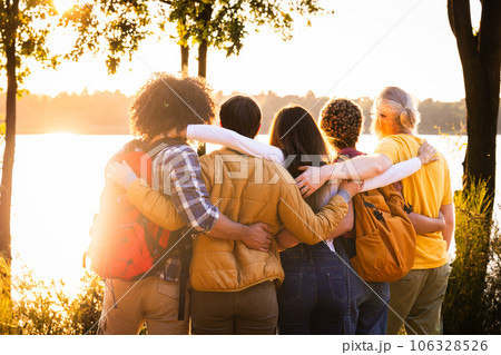 Sunset Embrace: Young Adventurers Admiring Forest Lake 106328526