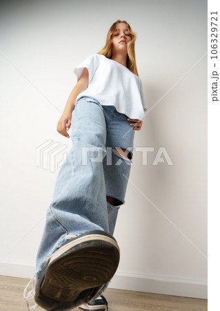Portrait of young beautiful cute teen girl posing at camera Portrait of young beautiful cute teen girl posing at camera 106329721