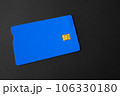 Green plastic bank card on a gray background. Mockup. Plastic card with chip. 106330180