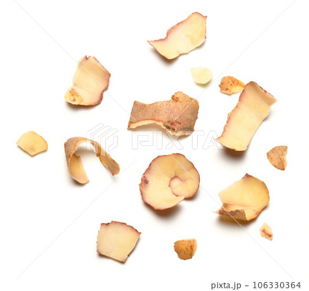 raw potato peel close-up, group of objects are isolated on a white background raw potato peel close-up, group of objects are isolated on a white background 106330364