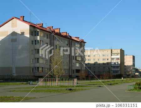 Multi-storey residential buildings are illuminated by the morning sun Multi-storey residential buildings are illuminated by the morning sun 106331151
