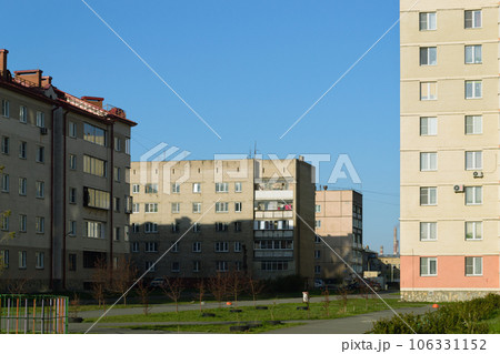 Multi-storey residential buildings are illuminated by the morning sun Multi-storey residential buildings are illuminated by the morning sun 106331152