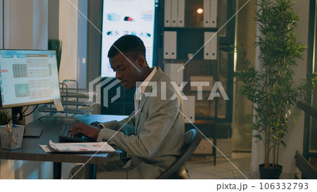 Stressed employees teamworking on company project tasks overnight before impending deadline. Experienced business colleagues comparing analytics datasets in office during nightshift 106332793