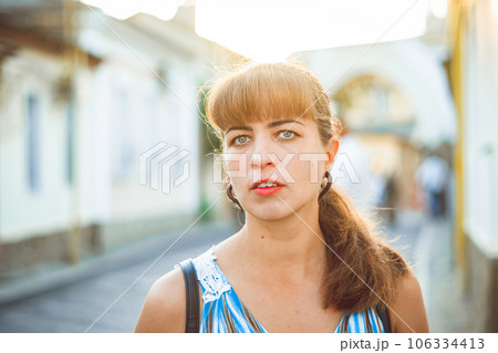 young girl in the setting sun 106334413