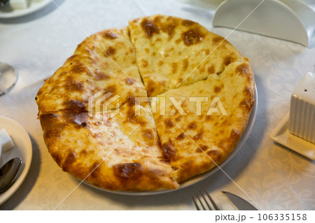 Traditional dish of Georgian cuisine is Khachapuri flatbread with cheese 106335158