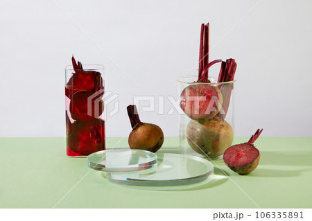 Some glassware containing beetroot slices with juice are displayed with transparent podiums. Laboratory concept with Beetroot (Beta vulgaris) extract. Product promotion Some glassware containing beetroot slices with juice are displayed with transparent podiums. Laboratory concept with Beetroot (Beta vulgaris) extract. Product promotion 106335891