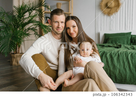 Portrait of a happy family with a young son at home 106342343