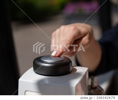 Woman pressing button to call waiter in cafe. Woman pressing button to call waiter in cafe. 106342679