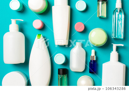 Group of plastic bodycare bottle Flat lay composition with cosmetic products on colored background empty space for you design. Set of White Cosmetic containers, top view with copy space Group of plastic bodycare bottle Flat lay composition with cosmetic products on colored background empty space for you design. Set of White Cosmetic containers, top view with copy space 106343286