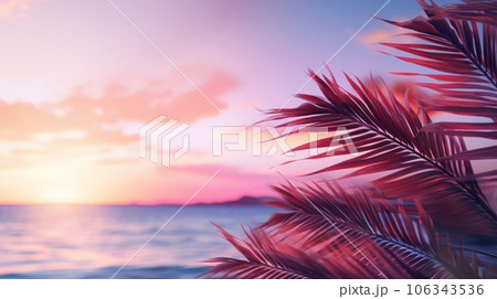 Close up of palm leaves with sunset sea in soft tones. Beautiful nature background. 106343536