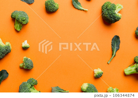 Flat lay composition with fresh green broccoli frame eith copy space on light background 106344874