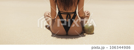 Bikini Beach Woman Buttocks in Black Swimsuit on Perfect Sandy Beach  106344986