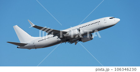 Airplane take off on the blue sky, Aircraft flying on sky background. White passenger jet plane in the blue sky. Low angle view of Airplane flying under blue sky 106346230