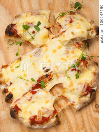 italian pizza margarita with lots of mozzarella italian pizza margarita with lots of mozzarella 106347590