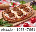 italian pizza bolognese on a wooden board 106347661