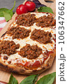 italian pizza bolognese on a wooden board 106347662