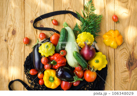 Autumn harvest of vegetables in a mesh bag Autumn harvest of vegetables in a mesh bag 106348029