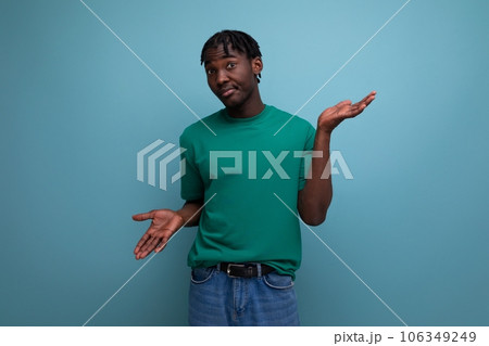 confused brunette african man with dreadlocks...の写真素材