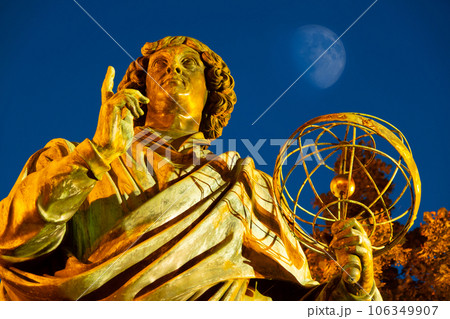 2022-07-04. Nicolaus Copernicus Monument. evening statue in front of the Old Town Hall, Torun, Poland. 2022-07-04. Nicolaus Copernicus Monument. evening statue in front of the Old Town Hall, Torun, Poland. 106349907