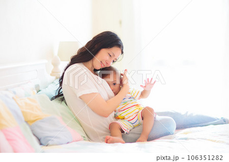 Mother nursing baby at home. Breastfeeding infant. Mother nursing baby at home. Breastfeeding infant. 106351282