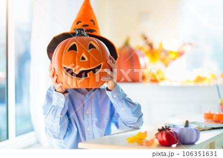 Family decorating home. Halloween arts and crafts. 106351631