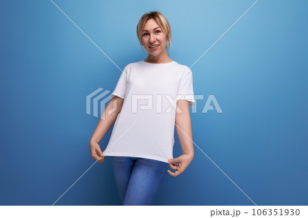 slim young woman dressed in a white tank top with a business mockup slim young woman dressed in a white tank top with a business mockup 106351930