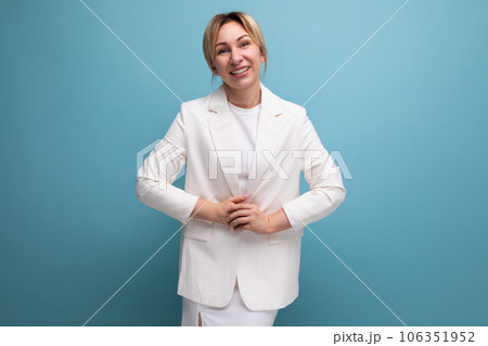 well-groomed slender young blond office woman in a white jacket and skirt well-groomed slender young blond office woman in a white jacket and skirt 106351952