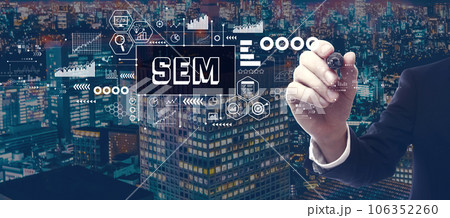 SEM with businessman in city at night 106352260