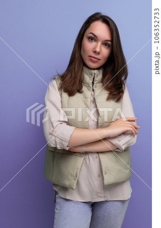 positive cheerful black-haired young lady in casual clothes over isolated background 106352733