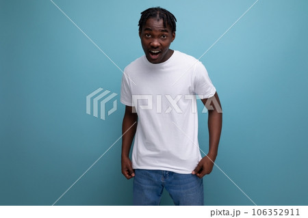 stylish young man with dreadlocks in a white...の写真素材