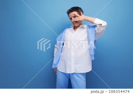 stylish young brunette woman with short haircut in white shirt stylish young brunette woman with short haircut in white shirt 106354474
