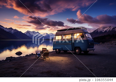 a camper van at nightfall near water lake 106355844
