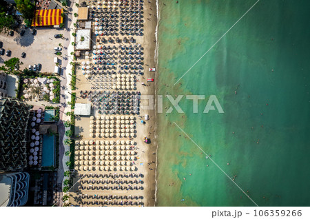 Golem, Durres, Albania - 22 august 2023: Aerial view to sandy beach full of umbrellas and people in summer season 2023 106359266