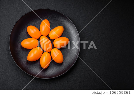 Bright juicy fresh yellow plum-shaped tomatoes. Preparing the tomato sauce Bright juicy fresh yellow plum-shaped tomatoes. Preparing the tomato sauce 106359861