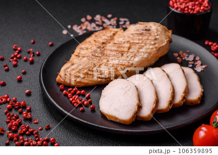Delicious juicy grilled chicken fillet with salt, spices and herbs 106359895