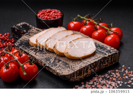 Delicious juicy grilled chicken fillet with salt, spices and herbs 106359915