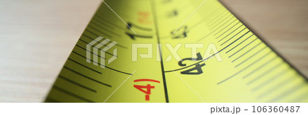 Macro yellow steel tape measure 106360487