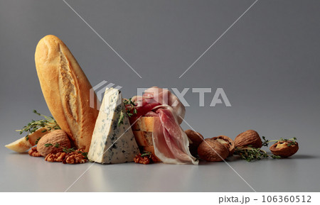 Prosciutto with blue cheese, baguette, walnuts, and thyme. 106360512