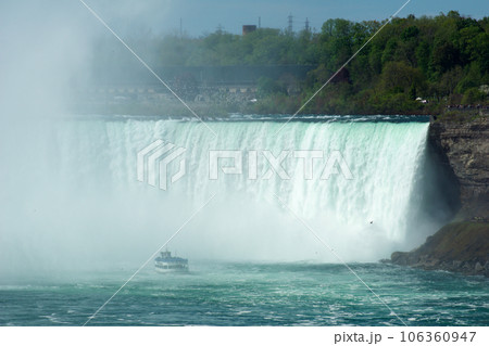 NIAGARA FALLS, ONTARIO, CANADA - MAY 20th 2018: Touristic boat on Horseshoe Falls, also known as Canadian Falls 106360947