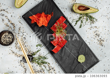 Traditional delicious fresh sushi roll set. Sushi roll with rice, nori, cream cheese, tobiko caviar, avocado. Sushi menu. Traditional delicious fresh sushi roll set. Sushi roll with rice, nori, cream cheese, tobiko caviar, avocado. Sushi menu. 106363093