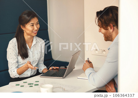 Smiling financial analyst consult client to increase business profitability sitting in coworking 106364337