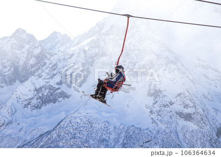 People are lifting on open lft high up in Caucasus mountains 106364634