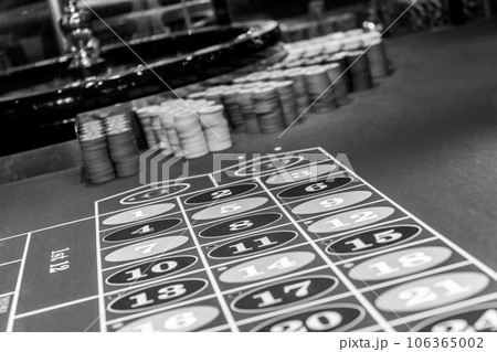 Roulette table in luxury casino. Black and white photo 106365002
