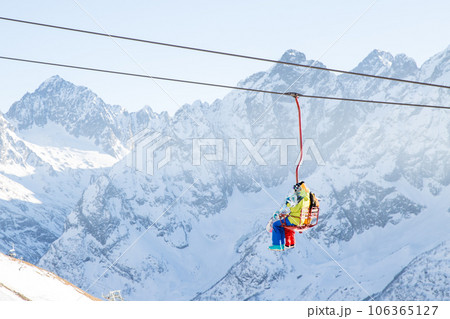 People are lifting on open lft high up in Caucasus mountains People are lifting on open lft high up in Caucasus mountains 106365127