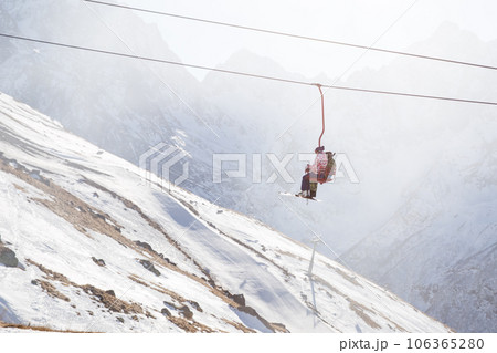 People are lifting on open lft high up in Caucasus mountains 106365280