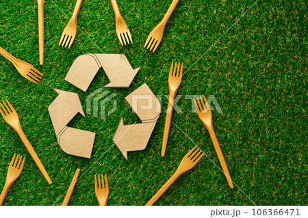 Zero waste disposable tableware forks on green background Zero waste disposable tableware forks on green background 106366471