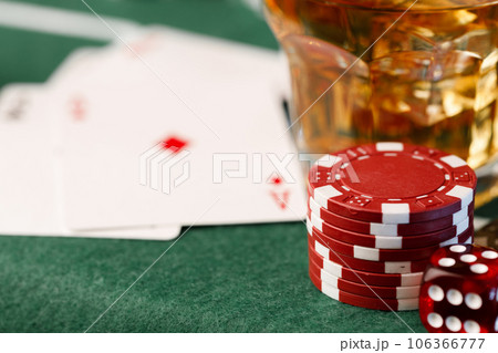 Cards, playing chips and alcohol in glass 106366777